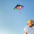 Little,Boy,Have,Fun,Playing,With,Kite,Outdoors,,Focus,On