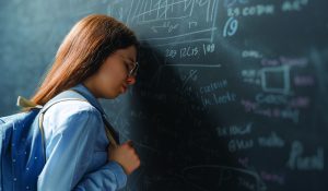 Back,To,School.,Unhappy,Teenager,Indoors.,Girl,Is,Learning,In