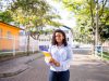 Portrait,Of,A,Young,College,Girl,Holding,Folders,And,Notebooks