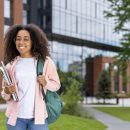 Smiling,African,American,Student,With,Glasses,And,Backpack,Standing,On