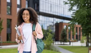 Smiling,African,American,Student,With,Glasses,And,Backpack,Standing,On