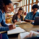 Group,Of,Happy,Classmates,Studying,Together,At,High,School,Library.