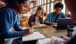 Group,Of,Happy,Classmates,Studying,Together,At,High,School,Library.