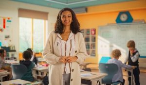 Portrait,Of,A,Beautiful,Happy,Young,Teacher,Standing,In,Classroom