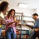 Group,Of,Students,Study,At,Library.,Learning,And,Preparing,For