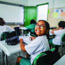 Portrait of a schoolgirl studying in the classroom at school
