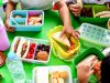 Children's,Hands,Reaching,For,Colorful,Lunchboxes,Filled,With,Sandwiches,,Fruits,