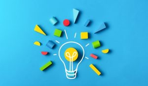 Idea,Creativity,Education,Concept,With,Lightbulb,Colorful,Geometric,Shapes,On