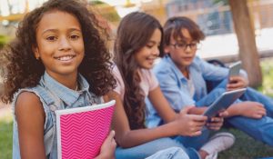 Portrait,Of,Preteen,African,School,Girl,And,Children,On,Background