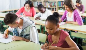 Young,Serious,Multiethnic,Students,Studying,Together,In,The,Classroom