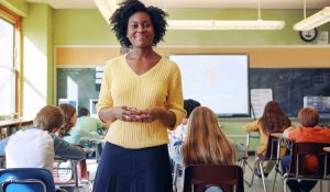 Portrait,,Teacher,And,Black,Woman,With,Students,Learning,In,Classroom.