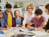 Multiethnic,Teenagers,Students,Focused,On,Learning,As,Teacher,Provides,Guidance