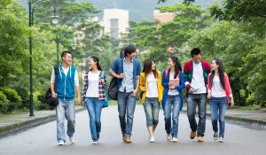 Asian,College,Students,Walking,Together,On,Campus