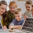 Young,Teacher,With,Solar,Panel,Learning,Pupils,About,Solar,Energy.