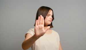 No.,Courageous,Latin,Teenager,Girl,Extend,Hand,In,Stop,Gesture