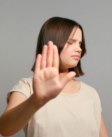 No.,Courageous,Latin,Teenager,Girl,Extend,Hand,In,Stop,Gesture
