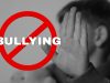 Stop,Bullying.,Upset,Little,Boy,Making,Stop,Gesture,,Black,And