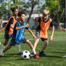 Group,Of,International,School,Kids,Playing,Soccer,Together,On,The