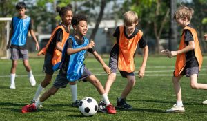 Group,Of,International,School,Kids,Playing,Soccer,Together,On,The