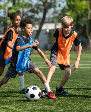 Group,Of,International,School,Kids,Playing,Soccer,Together,On,The