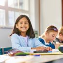 Portrait,Of,Excited,Cute,Little,Indian,Girl,Sitting,In,A