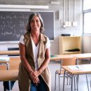 Portrait,Middle-aged,Female,High,School,Teacher,Looking,Smiling,At,Camera