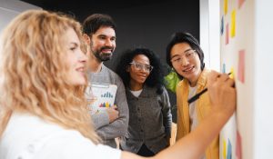 Group,Of,Multi,Ethnic,Colleagues,Collaborating,And,Sharing,Ideas,During