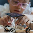 A,Young,Girl,Is,Building,A,Solar,Car,Out,Of
