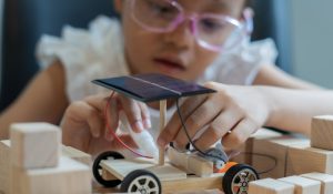 A,Young,Girl,Is,Building,A,Solar,Car,Out,Of