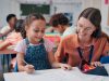 Education,,Girl,And,Teacher,In,Classroom,,Help,And,Support,With