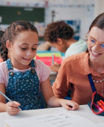Education,,Girl,And,Teacher,In,Classroom,,Help,And,Support,With