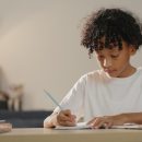 Little,Boy,Doing,Her,Homework,At,Home.,Study,At,Home