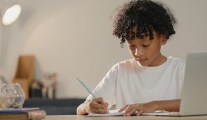 Little,Boy,Doing,Her,Homework,At,Home.,Study,At,Home