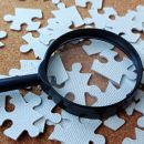 Research,And,Problem,Solving,Concept,With,Magnifying,Glass,And,Puzzle