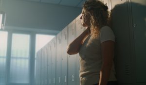 School,Teacher,Enjoys,Rare,Moment,Of,Silence,In,Empty,Locker